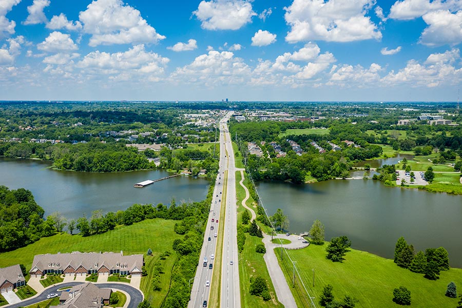 About Our Agency - Lexington, Kentucky’s Jacobson Park Lake on a Bright Sunny Day Seen From Above